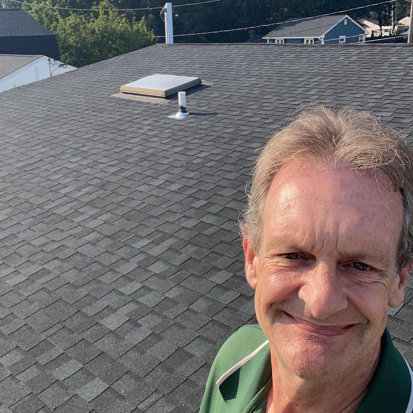 John inspecting a roof on a home in Suffolk County