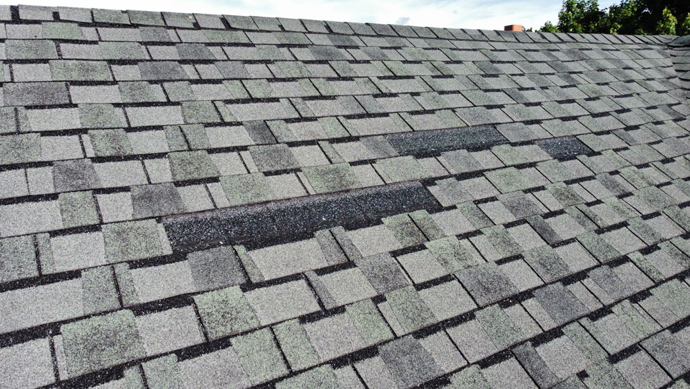 Roofing shingles missing from roof noted during home inspection