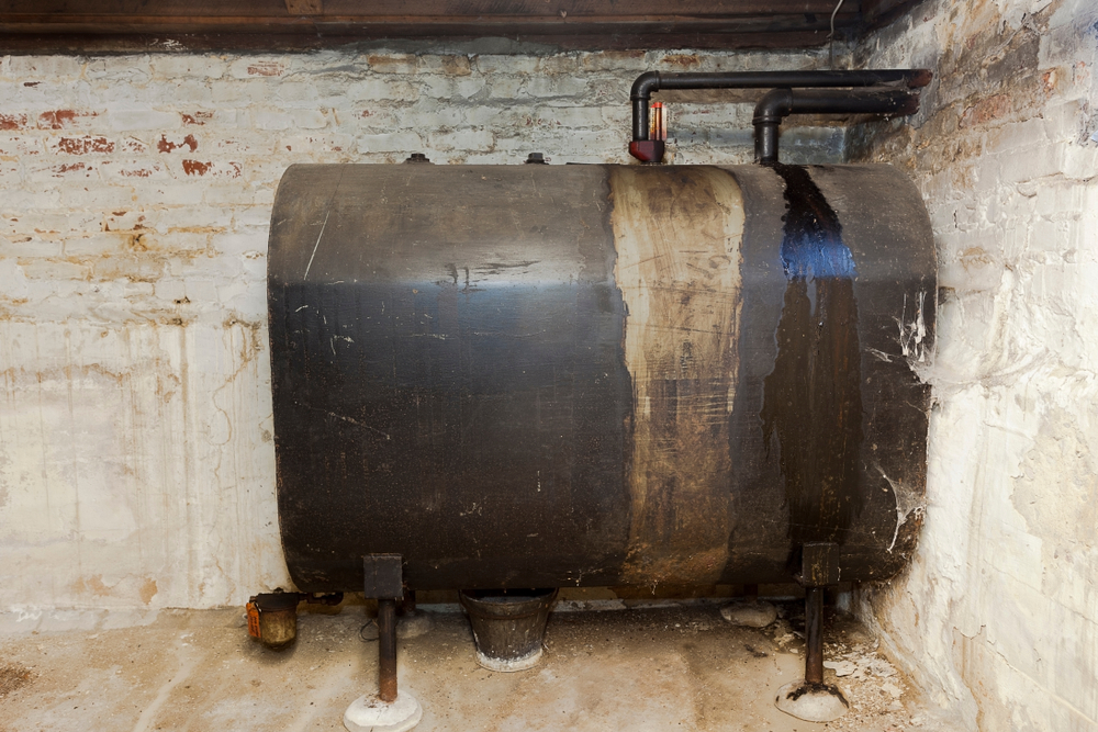 Old heating oil tank in dingy dank basement