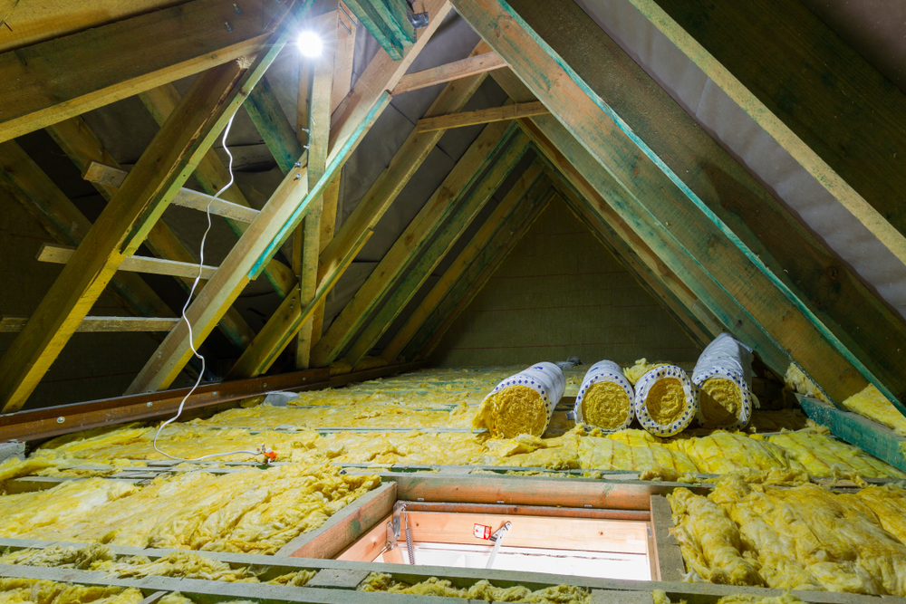 Empty attic in the house with mineral wool insulation